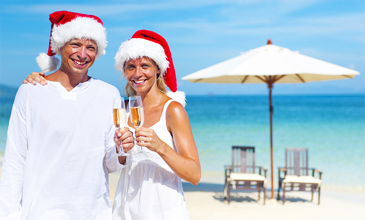 Couple Celebrating Christmas Beach Vacation Concept